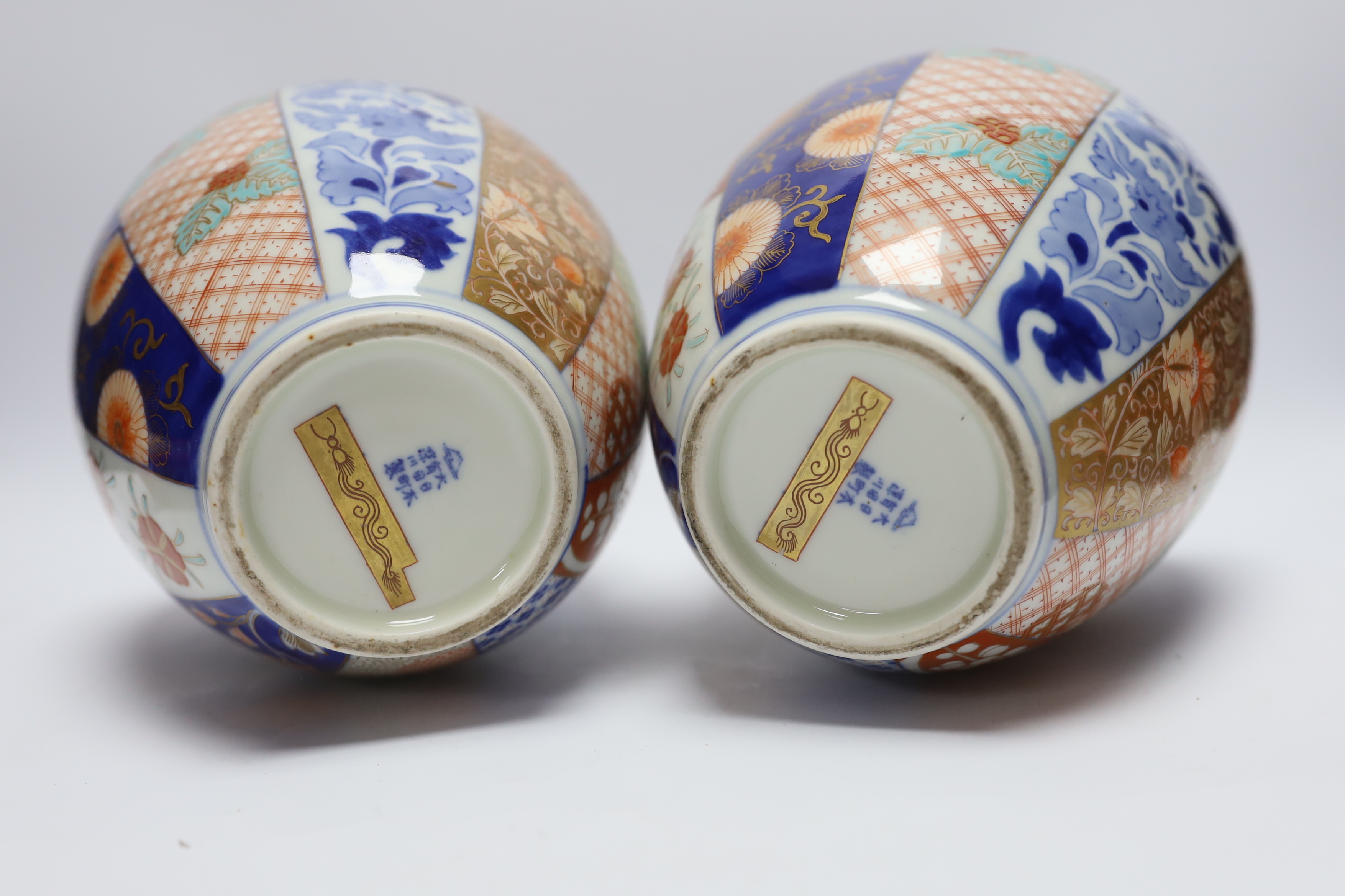 A pair of Japanese Imari vases, by Fukagawa and a pair of Kutani vases, Meiji period, tallest 25cm